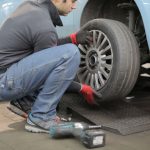 a man is changing the car tires
