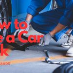 a mechanic using a car jack