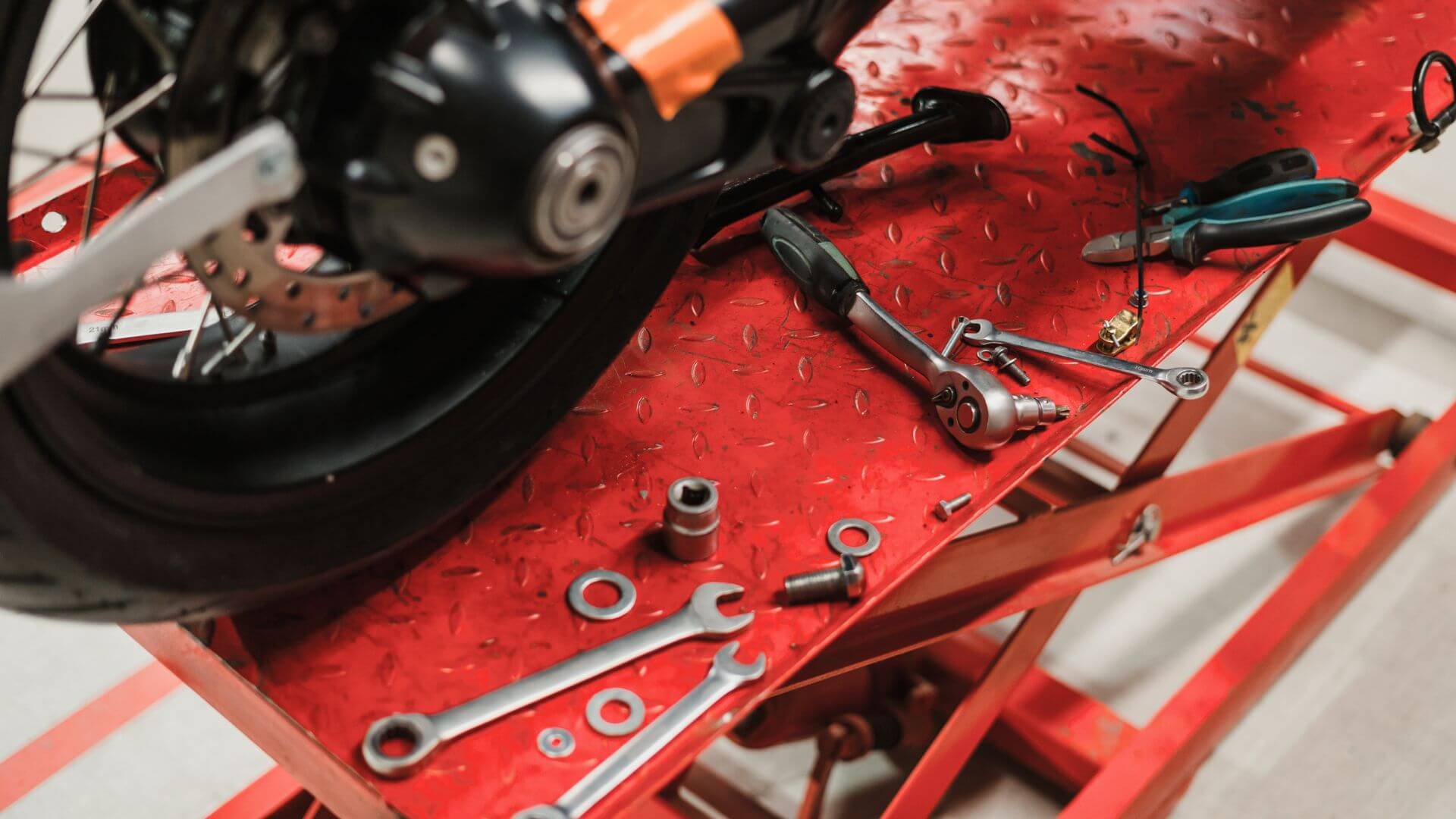 a picture of tools that are being used to repair a motorcycle