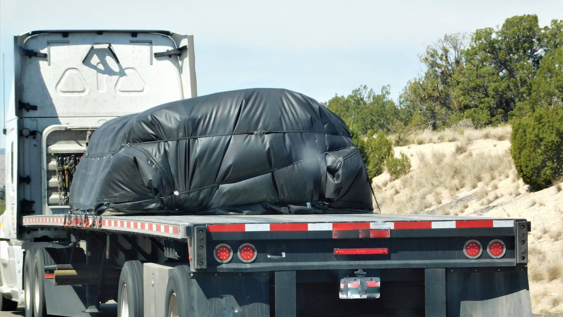 a Motorcycle Transported using Flatbed Trailer